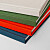 Dos des carnets rouge, vert, beige et bleu Dos des carnets rouge, vert, beige et bleu